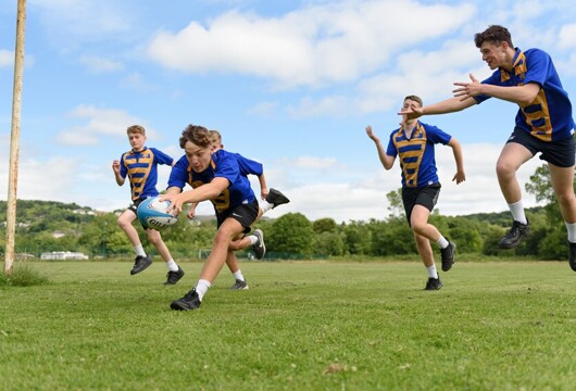 Cwmtawe pupils playing rugby outside